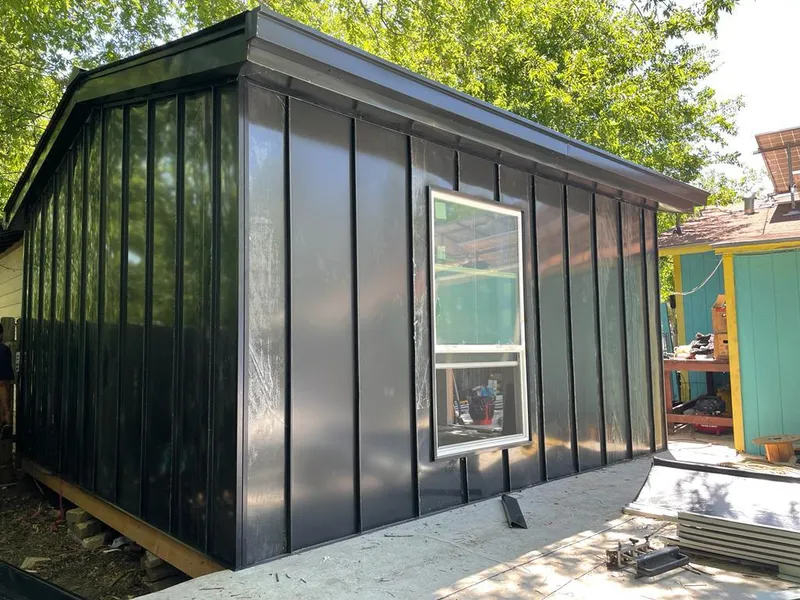 Black standing seam metal wall panels for Metal Roof Installation in Otsego